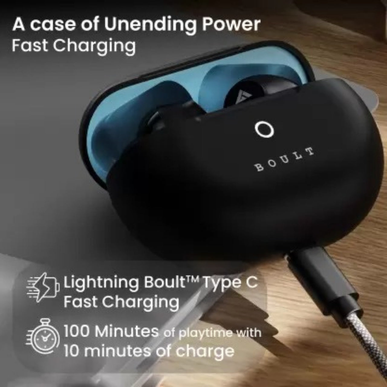 Black charging case with earbuds, featuring 'BOULT' branding, on a wooden surface.