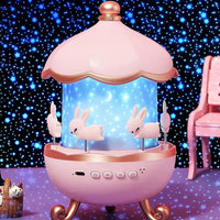 Pink carousel with rabbit figures against a starry background