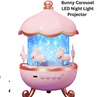 Pink bunny carousel LED night light projector with blue interior on a white background