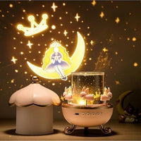 Decorative night light with fairy tale design and rabbit figurines on a dark background