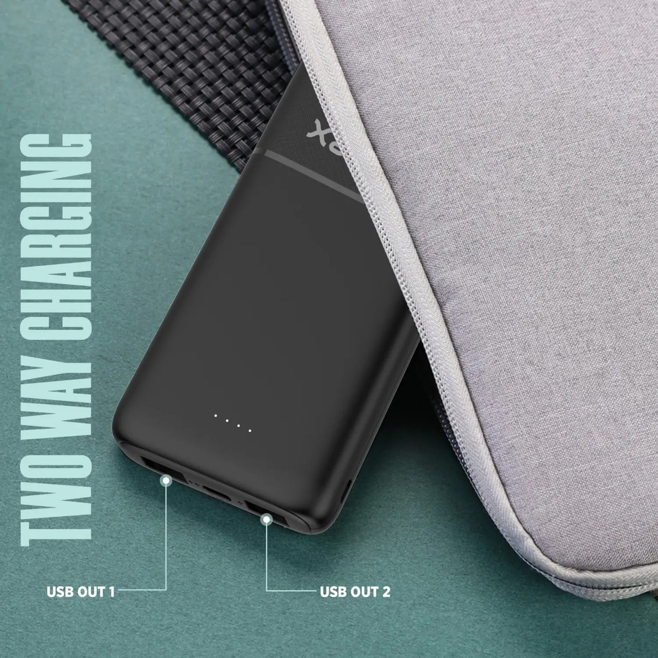 Black two-way charging device with USB ports on a gray surface