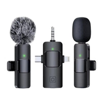 Three microphones with different types of windshields on a white background