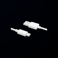 Two white USB connectors on a black background