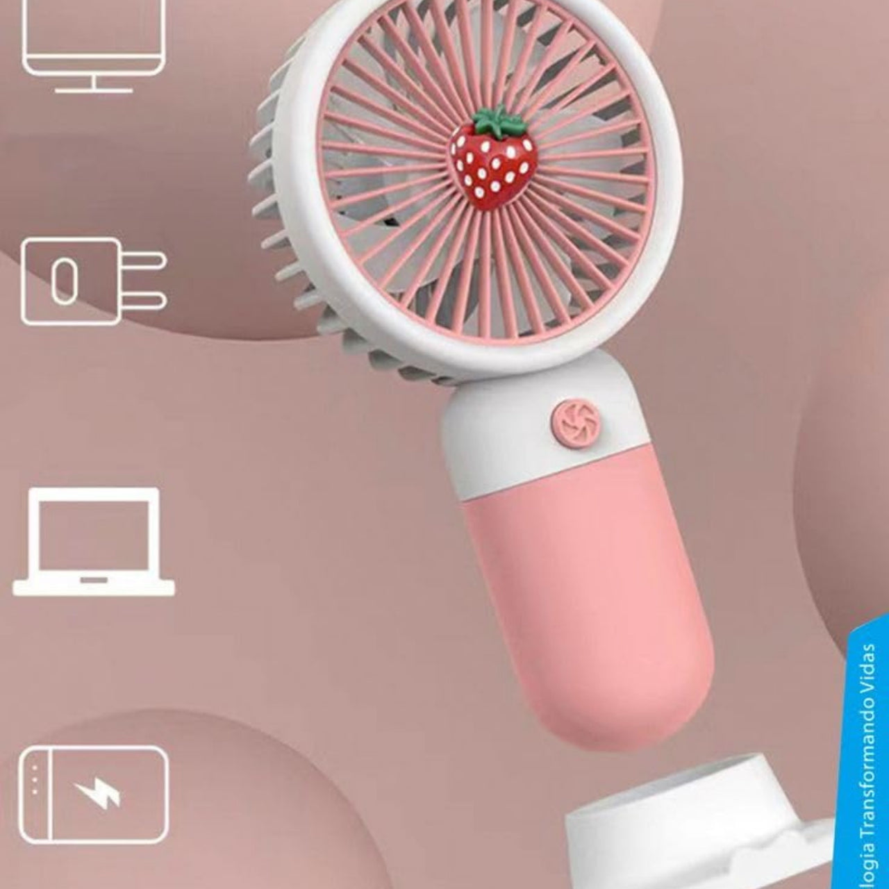 Pink handheld fan with strawberry design on a pink background