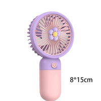 Small handheld fan with a floral design on a white background