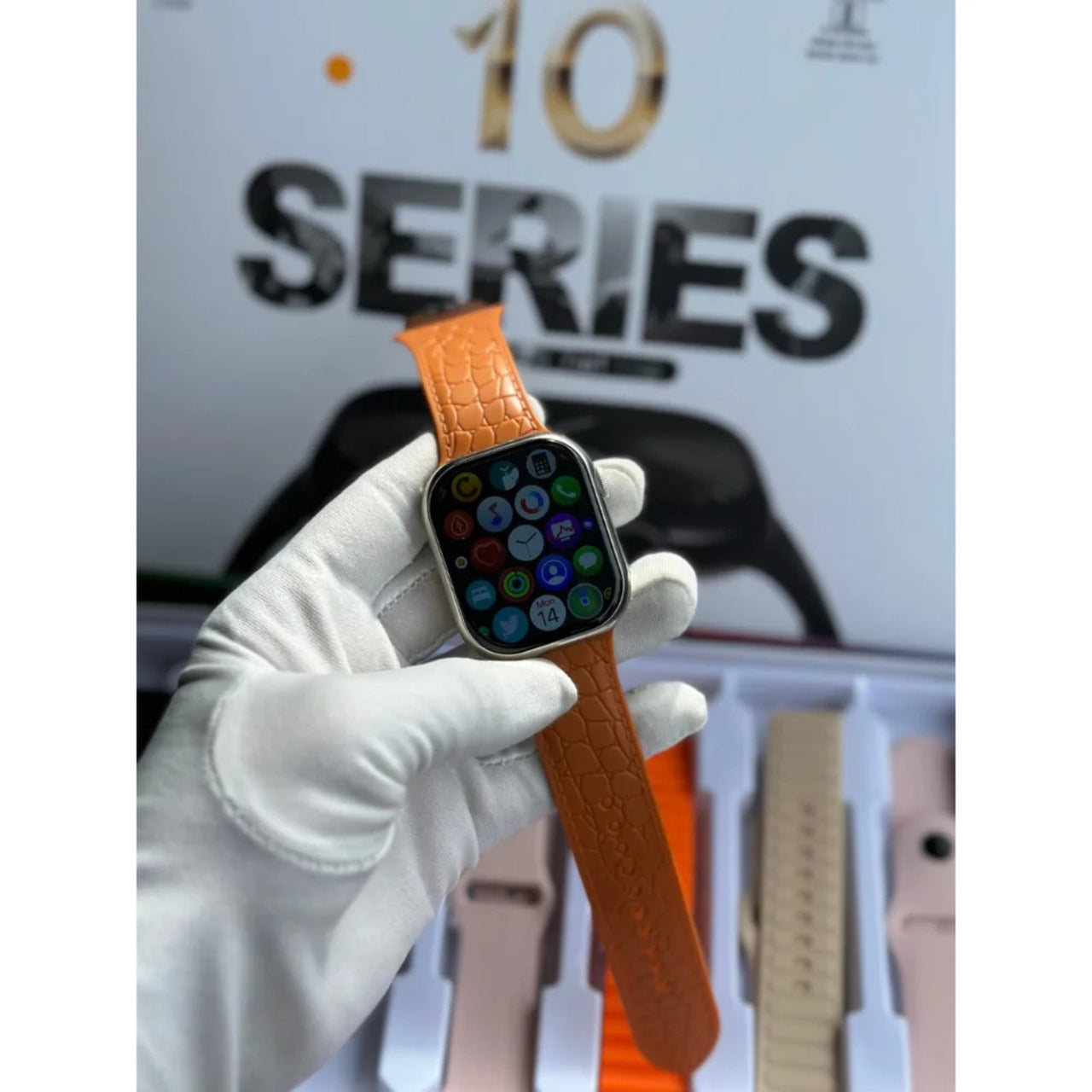 Smartwatch with brown strap held by a gloved hand, with 'Series 10' text in the background