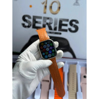 Smartwatch with brown strap held by a gloved hand, with 'Series 10' text in the background