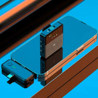 Two electronic devices on a reflective surface with a blue and brown gradient background