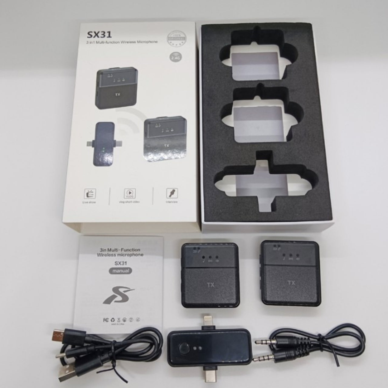 Wireless microphone system with packaging and accessories on a white background