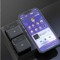 Phone displaying a music app with two black electronic devices labeled 'TX' and 'RX' on a dark textured surface.