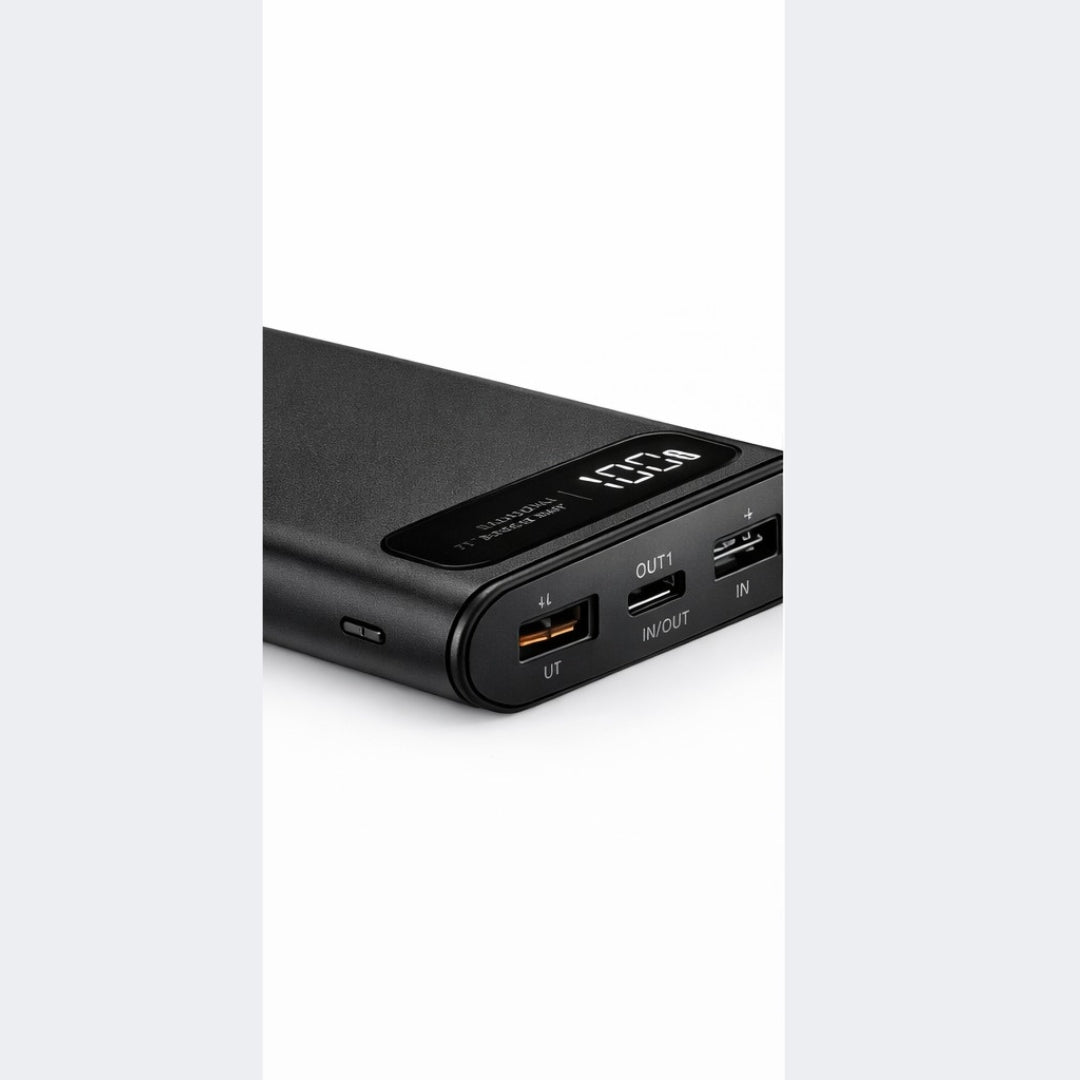 Black power bank with multiple ports on a white background
