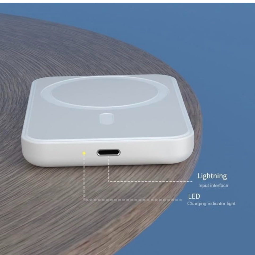White electronic device with Lightning input interface and LED indicator on a wooden surface