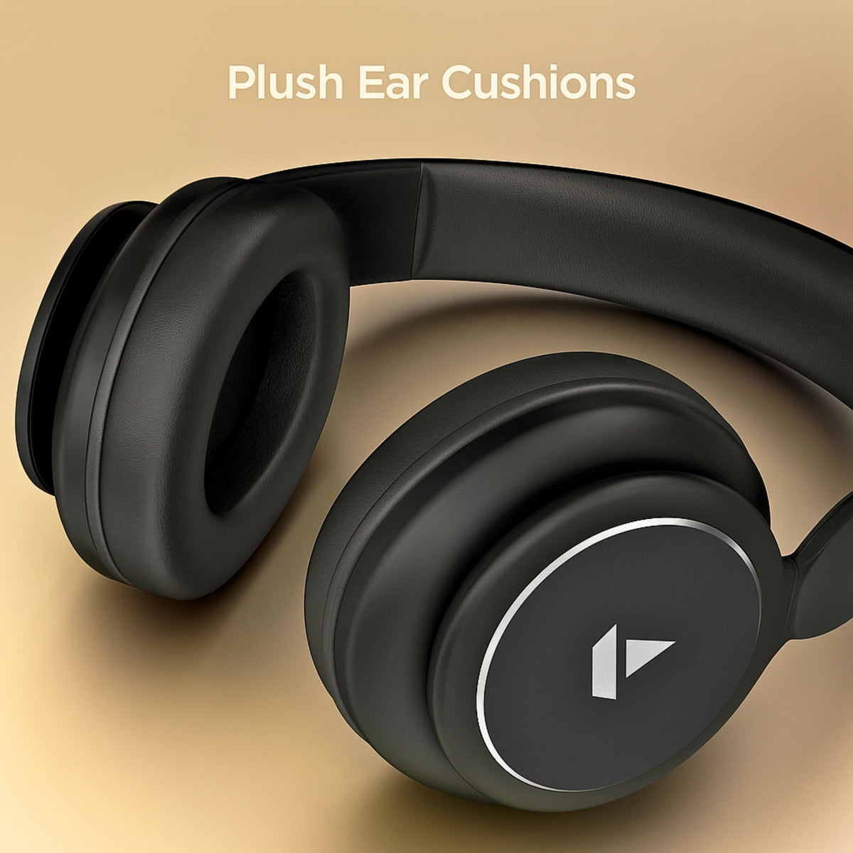 Black headphones with plush ear cushions on a beige background