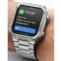 Smartwatch displaying a WhatsApp message on a wrist