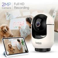 White security camera with 'helea' branding displaying a child and dog on a tablet screen.