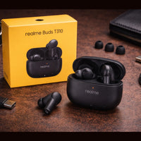 Black wireless earbuds with open charging case and yellow 'realme Buds T310' box on a dark surface.